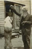  Reverand Franklin playing with dog.